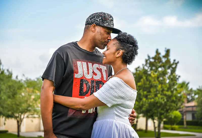 How We Help - Care and Counseling Couple hugging while standing outside