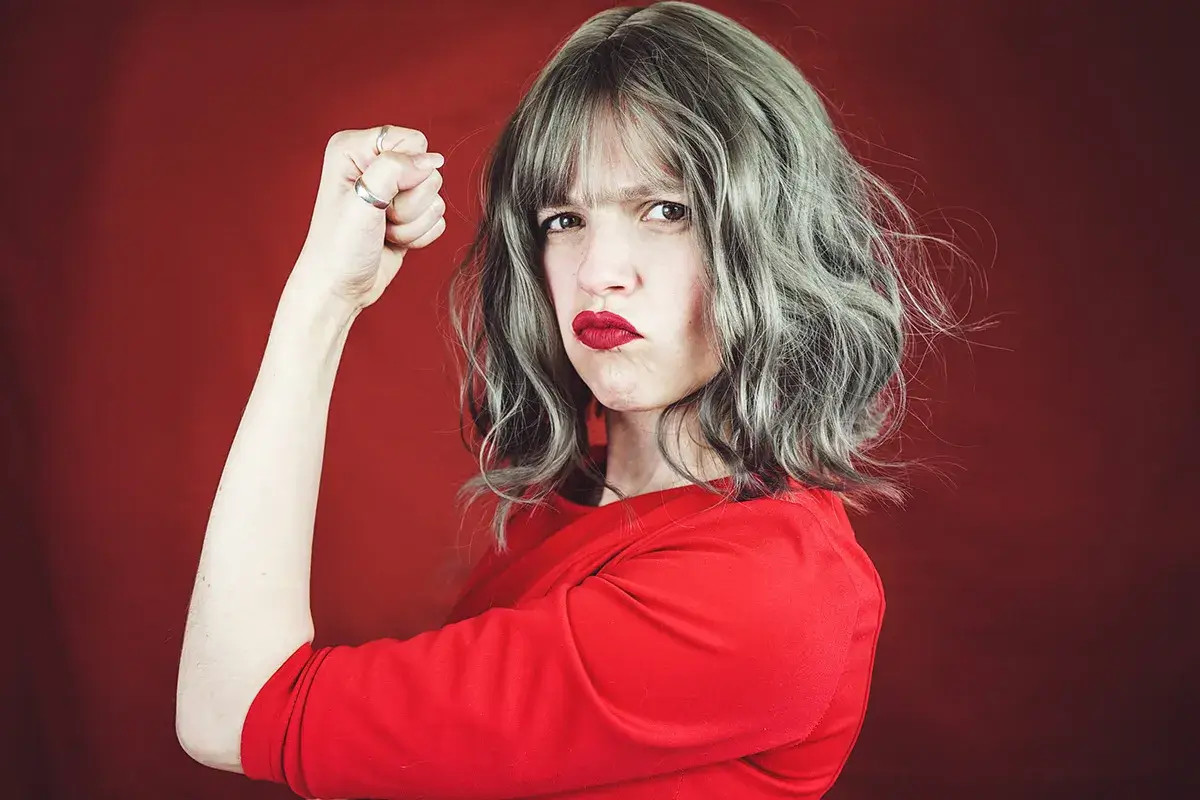 A woman flexing her bicep