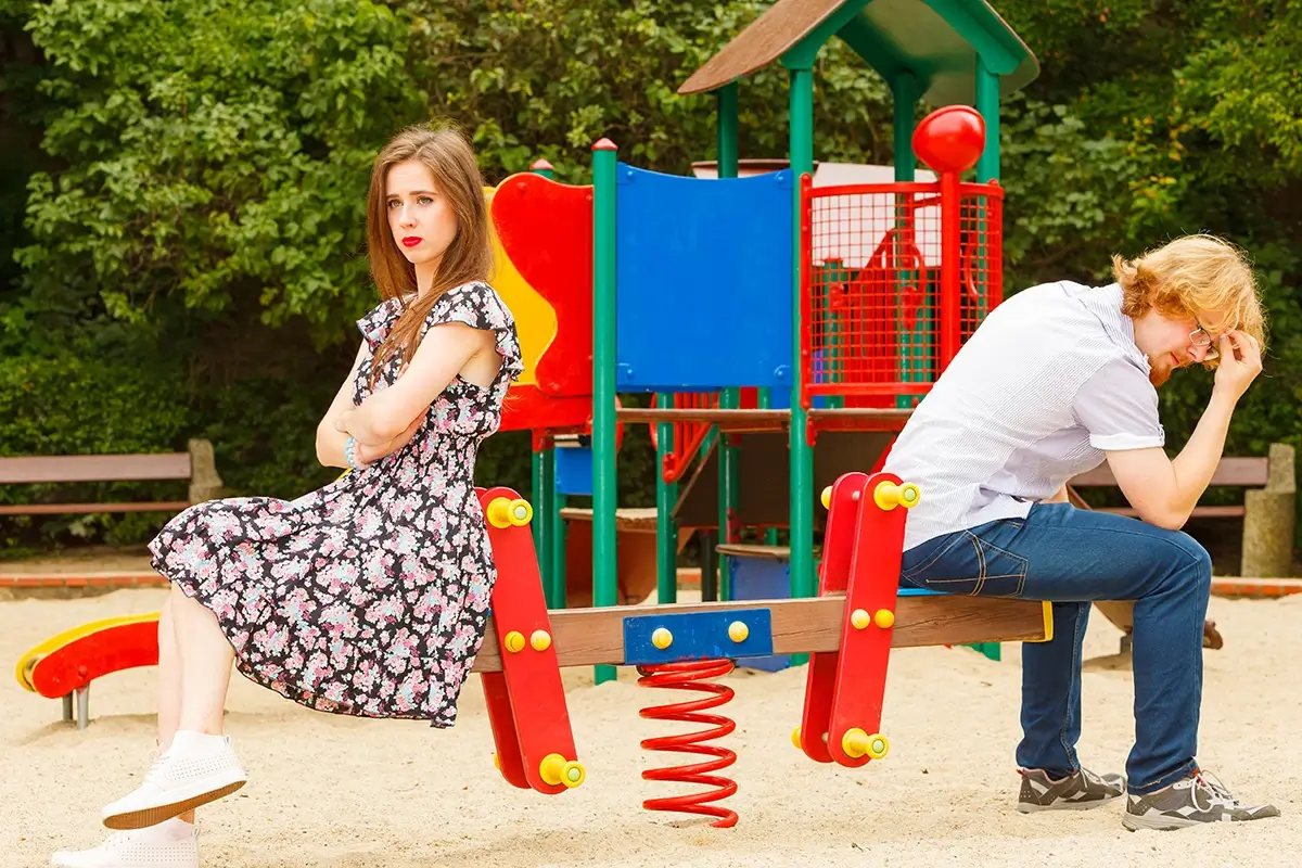 A couple fighting on a playground