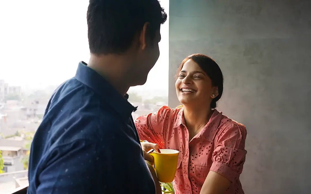 A woman smiling at her husband