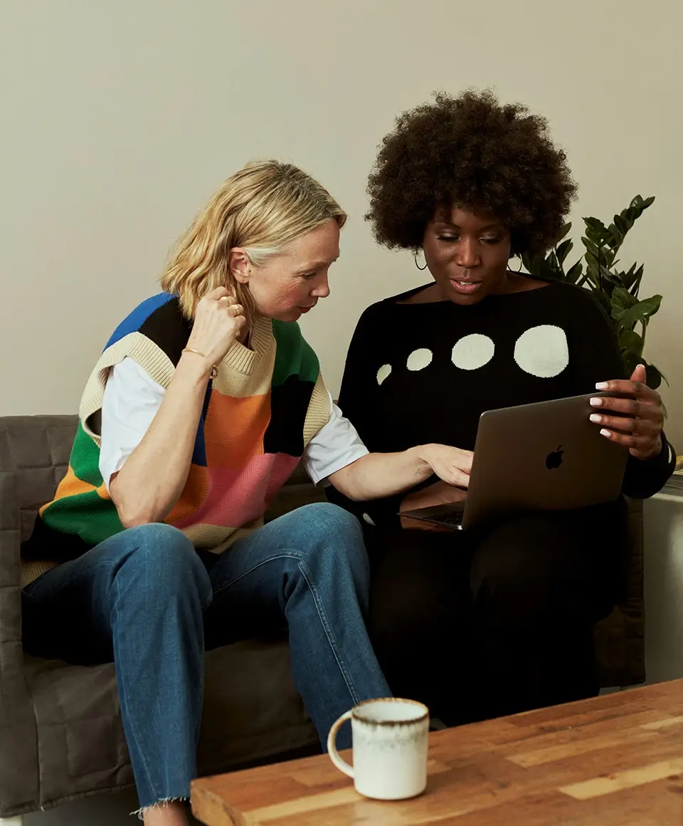 Stand in the Gap Women looking at computer together