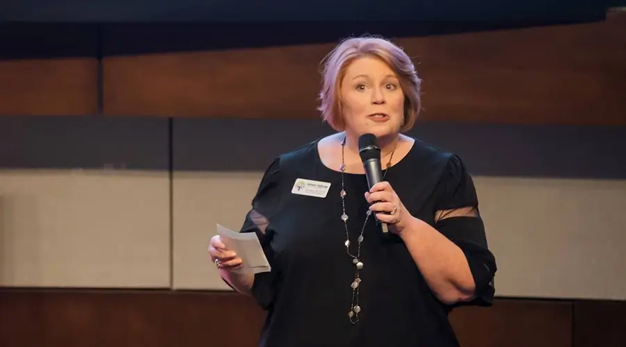 Traci speaking to professionals